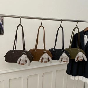 Chic suede Boston shoulder bags in dark coffee, caramel, black and green with bunny charms