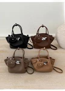 Chic wing-shaped handbags in four colors featuring lychee texture and bow charms