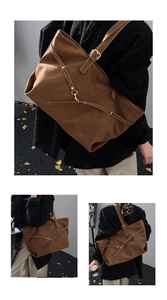 Close-up of vintage brown matte leather tote bag with stylish thin straps and gold buckle