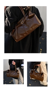 Detail of vintage oil wax leather tote bag showing large capacity and adjustable metal buckle