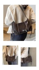 Detailed shots of a dark brown matte leather shoulder bag with white contrast stitching