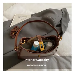Interior view showing the large capacity and long strap of a brown leather shoulder bag
