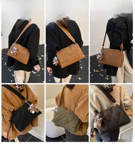 Quilted crossbody bag with adjustable wide strap and plush bear charm detail