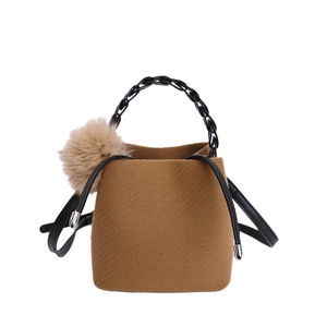 Brown vintage wool felt bucket bag with black chain handle and soft pompom charm