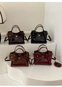 Detailed display of vintage large tote bags in black, coffee, tan and burgundy leather