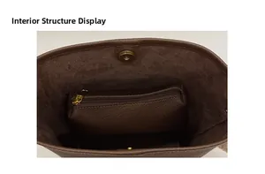 Close-up of the spacious interior with inner zipper pouch and magnetic snap closure