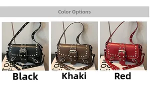 Detail view of vintage motorcycle shoulder bags in black, khaki, and red with metal rivets