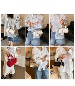 Detailed view of mini cylinder bags in white, red, silver, and black with plush charms