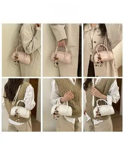 Collage of a retro Boston bag shown with various stylish outfits and a floral charm