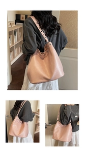 Detail showing silver eyelets on light pink faux leather large Hobo bag shoulder strap