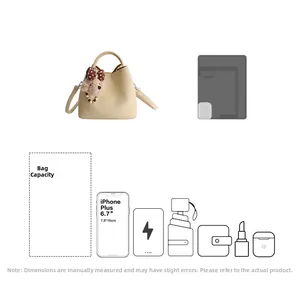 Detail showing beige bucket bag capacity for iPad, smartphone, umbrella and essentials