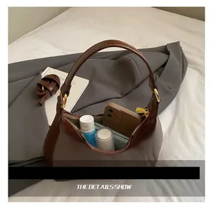 Detail view of the brown oil wax leather bag interior showing daily storage capacity