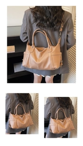Detail of tan lychee grain leather handbag with dual rings and adjustable shoulder strap