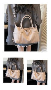 Detailed view of pink pebble leather tote bag featuring dual handles and adjustable strap