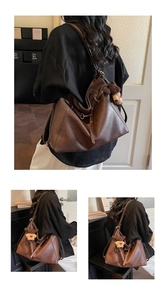 Detail of dark brown leather tote bag featuring a cute teddy bear charm and soft texture