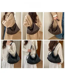 Detail showing high-capacity leather hobo bags with pleated straps in black and dark brown