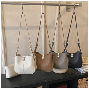 Detail view of the large capacity bucket bag showing four colors and silver metal hardware