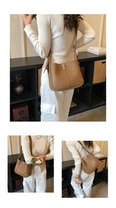 Close-up of brown litchi grain leather bucket bag with a silver metal buckle closure