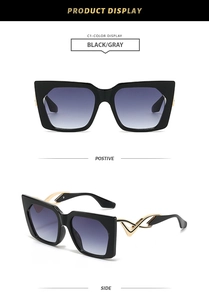 Detail of square oversized sunglasses with gold hollow curved metal temples and black frames