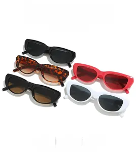 Collection of retro cat-eye sunglasses in multiple colors with wide frames and dark lenses