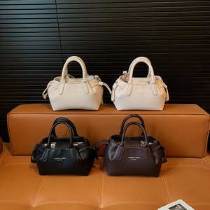 Chic textured leather wing-shaped handbags with gold lettering in four versatile colors