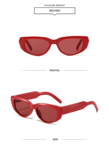 Detail view of bold red cat-eye sunglasses with wide temples and UV protection