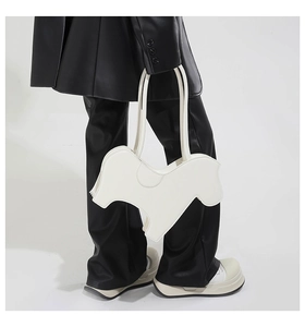 Detail of unique zebra-shaped white PU shoulder bag with high-quality matte leather finish