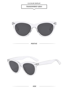Modern cat eye sunglasses in transparent gray with dark gray lenses shown from two angles