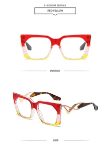 Detail of square oversized sunglasses with red yellow gradient frames and gold metal V-shaped arms
