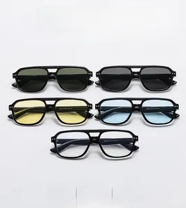 Detailed row of pilot sunglasses with double bridge frames in five diverse lens colors