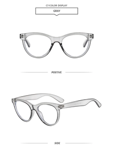 Detail view of translucent gray cat-eye sunglasses with retro rivets on the frame