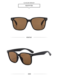 Detail view of black square sunglasses with tea lenses and classic silver rivets on the frame