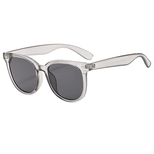 Modern square semi-transparent grey sunglasses with dark UV400 lenses on white background