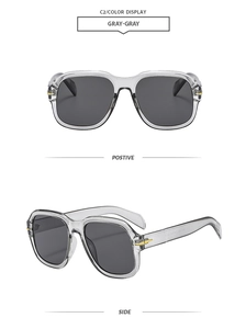 Detail of square gray acetate sunglasses with gold arrow hinges and gradient lenses