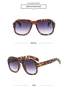 Detail view of tortoiseshell square sunglasses with gradient grey lenses and metal hinge