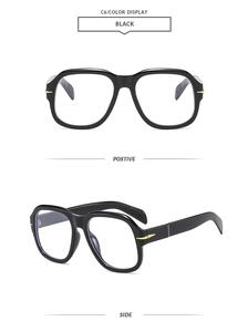 Detail of retro large square sunglasses with black frame and golden metal temple hinges