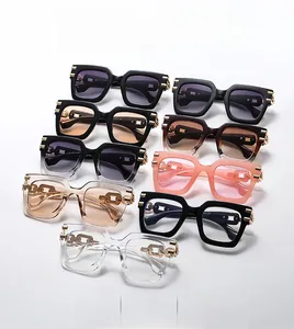 Close-up of square sunglasses with unique metal chain links on multi-colored frames