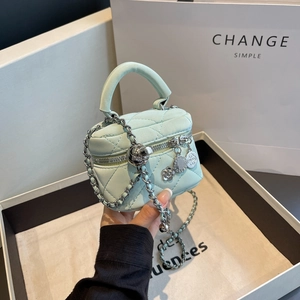 Mint green quilted mini chain bag with camellia charm and circular handle for women