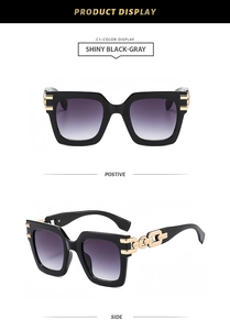 Detail view of square sunglasses featuring bold golden chain temples and gradient lenses
