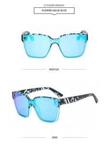 Detail of tortoise shell oversized sunglasses with blue lenses and power icon detail
