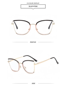Detail of pink and black cat-eye glasses frame with sleek golden metal temples