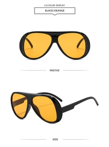Detailansicht der schwarzen Oversize-Aviator-Sonnenbrille mit orangefarbenen Gläsern