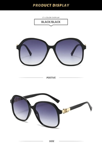 Detail view of square black sunglasses with golden H metal hinge and gradient purple lens