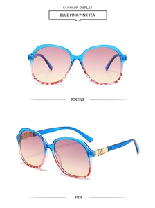 Detail view of square oversized sunglasses with blue floral frame and metal H hinge decoration