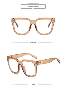 Detail view of vintage square brown sunglasses with decorative gold temple hardware