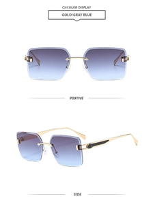 Close-up of gold metal temples and gray-blue gradient lenses on rimless sunglasses