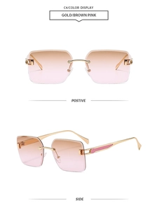 Detail view of rimless square sunglasses with gold metal frame and gradient pink lenses