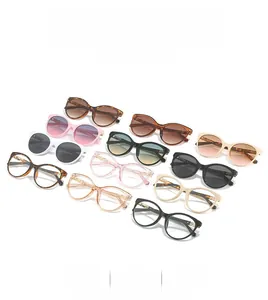 Collection of retro round sunglasses and frames in various colors with metal temple detail
