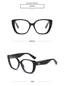 Detail of black cat-eye glasses frame featuring a golden LH metal logo on the temple side