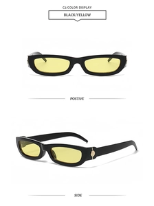 Detail of trendy small rectangular sunglasses with black frames and yellow lenses